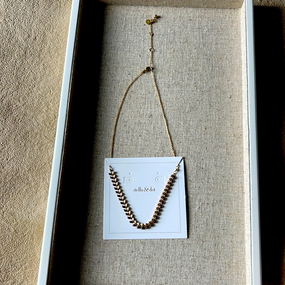 Enamel black and white/coral necklace.